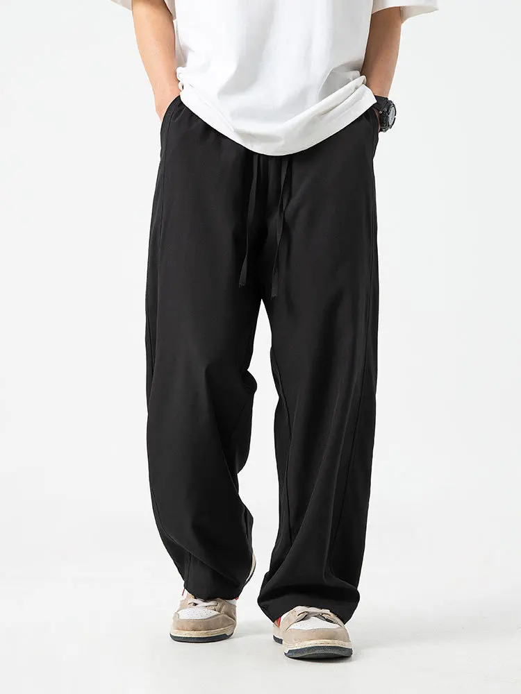S048fc145d2f6456b853b834a11ea54edX.webp 2026 Men's Ice Silk Wide Leg Pants Thin Man Black Comfortable Quick Drying Pants Summer Loose Casual Streetwear Loose Trouser